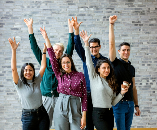 Empowering firms Empowering firms - image shows happy people raising hands in the air